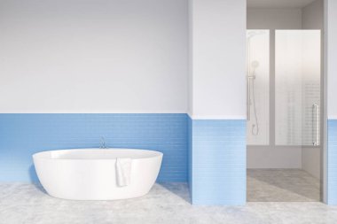 Interior of stylish bathroom with white and blue brick walls, concrete floor, white bathtub and shower with glass door. 3d rendering