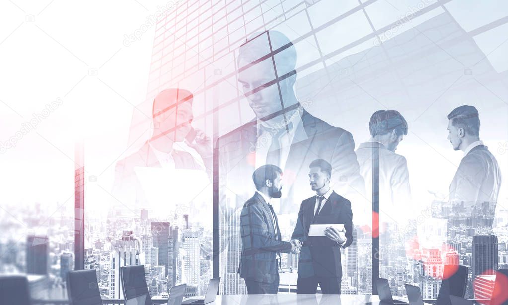 Team of diverse managers working with gadgets and documents over skyscraper background with double exposure of meeting room. Concept of CEO work. Toned image double exposure