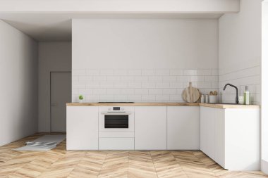 İç ahşap zemin beyaz duvarlı küçük mutfak ile beyaz mutfak tezgahı fırın ve lavabo ve bir kapı inşa. 3D render