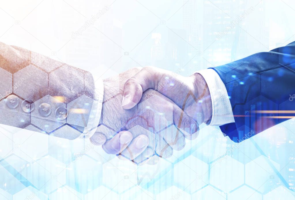 Close up of two businessmen shaking hands over blurred cityscape background with double exposure of graph and hexagonal pattern. Concept of partnership. Toned image