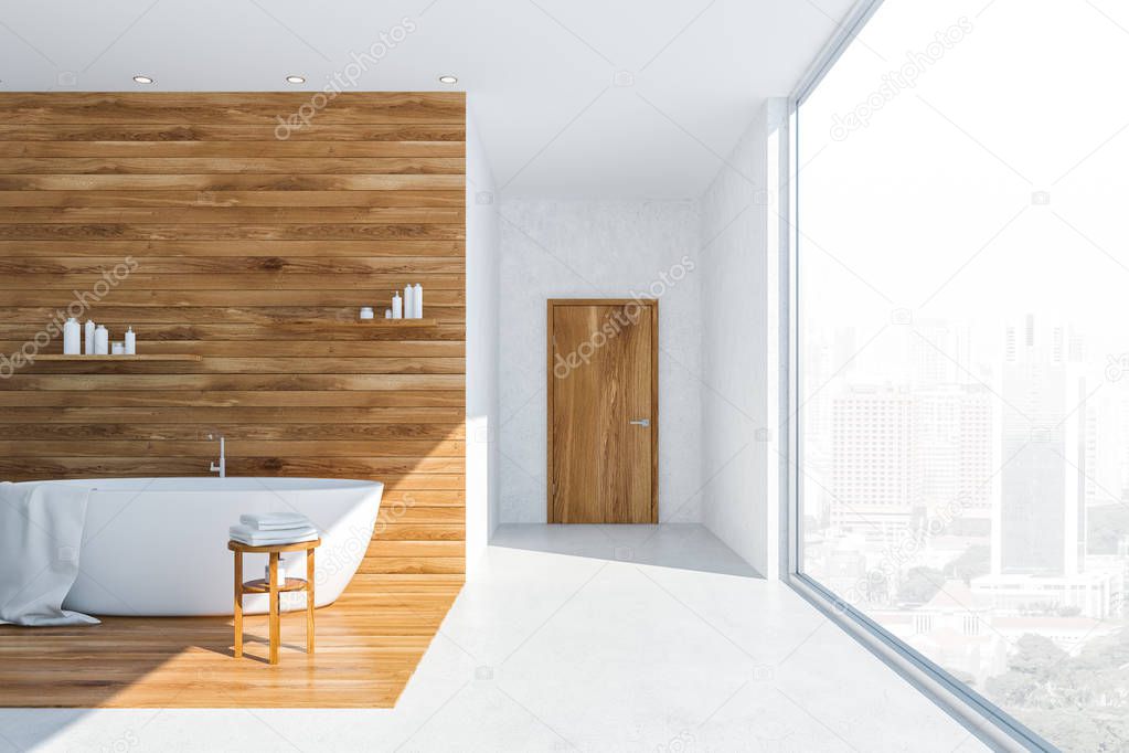 Interior of panoramic bathroom with white and wooden walls, concrete floor, white bathtub with white towel on it and shelves with shampoos and creams above it. 3d rendering