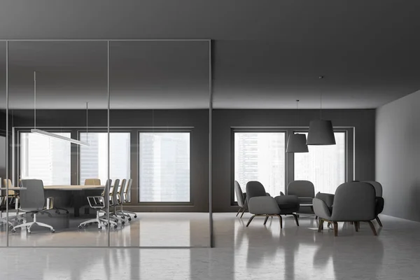Interior of modern meeting room with gray and glass walls, concrete floor, large windows, long beige and gray table with chairs and lounge area to the right. 3d rendering