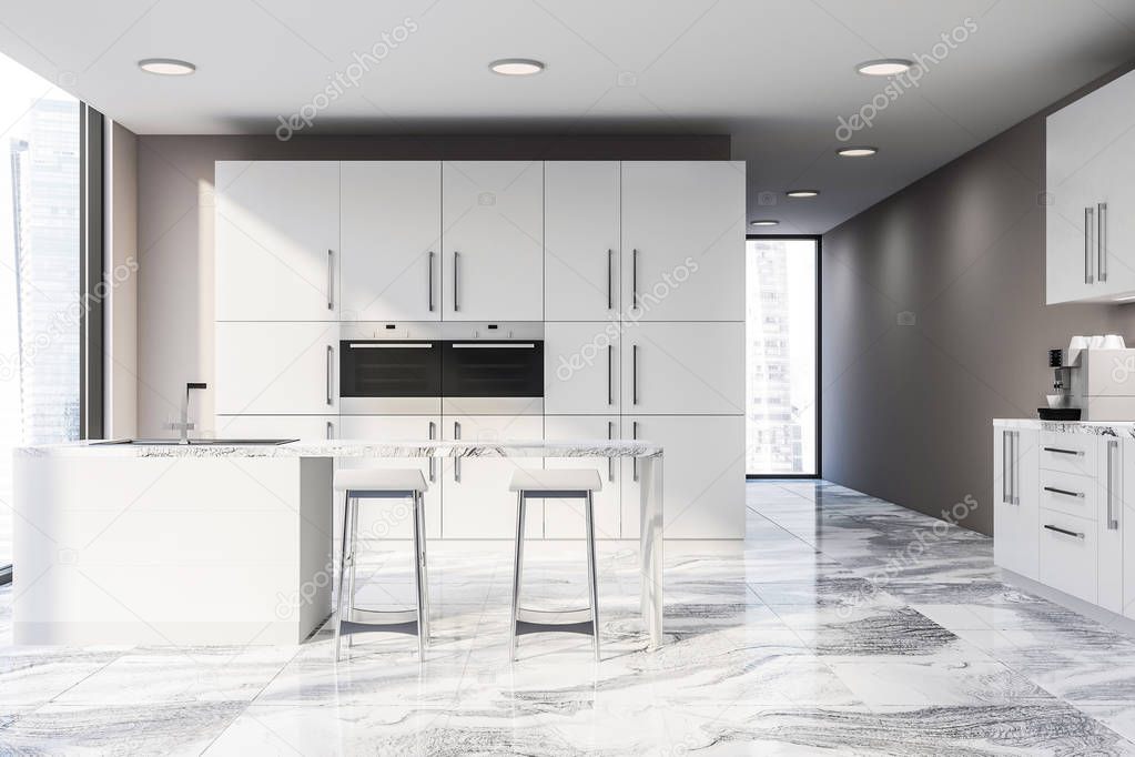 Interior of modern kitchen with beige walls, marble floor, white bar with stools and white cupboard with two built in ovens. 3d rendering
