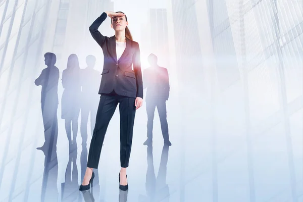 Young Businesswoman Looking Forward Silhouettes Her Colleagues Background Double Exposure — Stock Photo, Image
