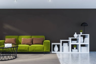 İç kahverengi duvarlar, taş zemine, yuvarlak sehpa ve beyaz kitap rafı yakın duran yeşil kanepe ile modern oturma odası. 3D render