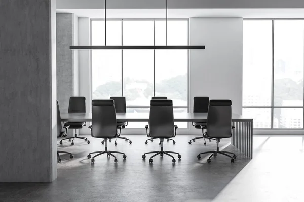 Interior of office conference room with concrete and white walls, concrete floor, large window and long gray table with black chairs. 3d rendering