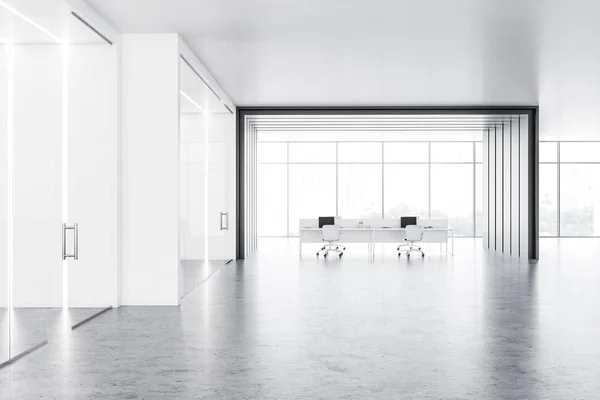 Office lobby with white and gray walls, concrete floor, glass doors and open space office area with white computer tables near panoramic window. 3d rendering