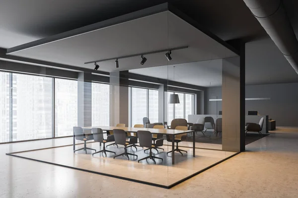 Corner of office meeting room with gray and glass walls, concrete floor, panoramic windows and long gray table with gray chairs around it. Lounge in background. 3d rendering