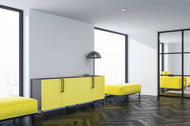 Beyaz duvarları, koyu ahşap zemin, geniş pencereler ve sarı sarı divanlar arasında lamba duran ile kabine modern oturma odası köşesinde. 3D render