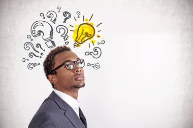 Inspired African man, question marks and bulb clipart