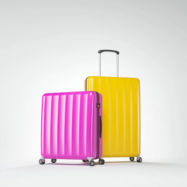 Różowy i żółty walizki na białym — Zdjęcie stockowe
