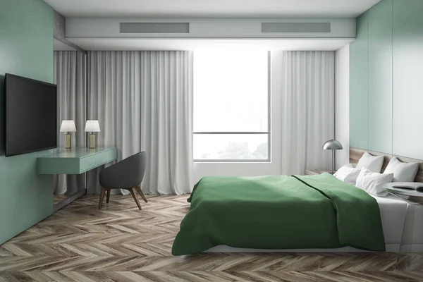 Зеленый интерьер спальни с телевизором — стоковое фото
