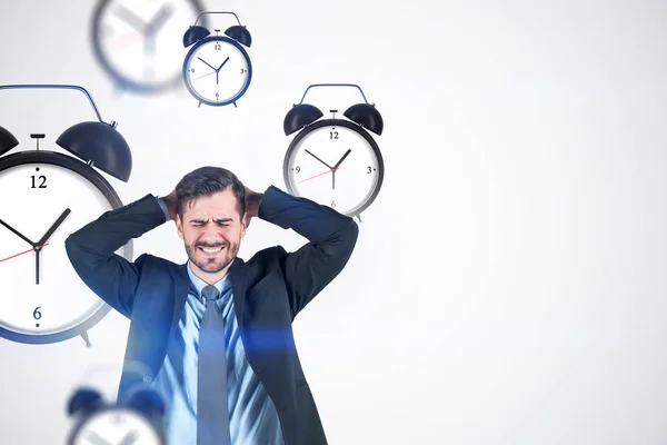 Stressed man, alarm clocks, white — Stock Photo, Image