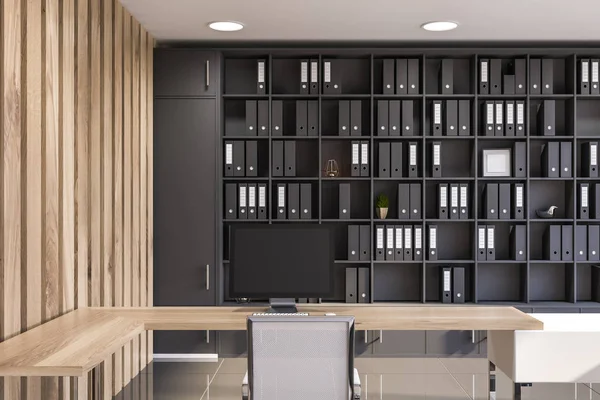 Gray and wooden office interior, bookshelves