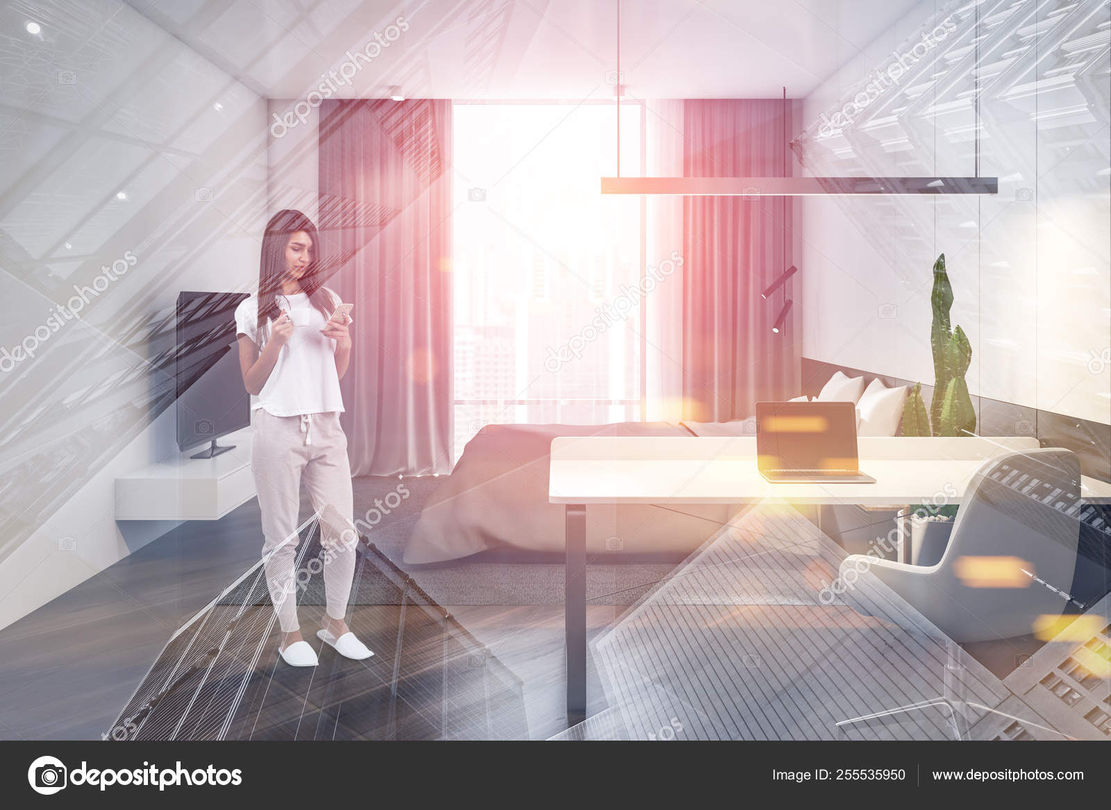 Young Woman In Stylish Bedroom With Computer Desk Stock Photo