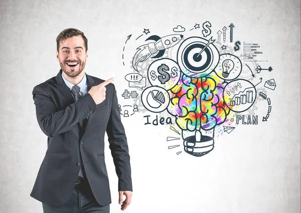 Uomo felice che punta a bozzetto idea di business — Foto Stock