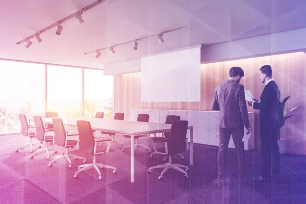 People in conference room with poster — Stock Photo, Image