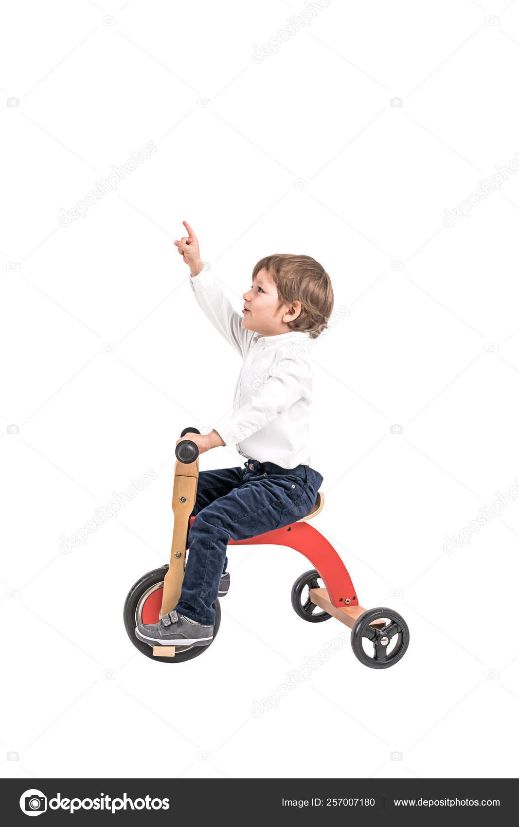 boy on tricycle