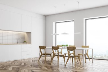 Sayaç ve masa ile beyaz mutfak köşesi