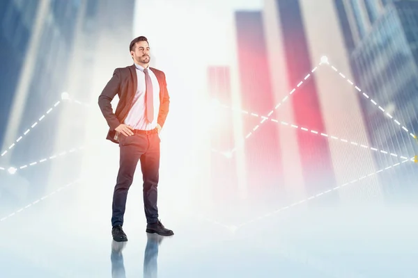 Confident businessman in city, graphs — Stock Photo, Image