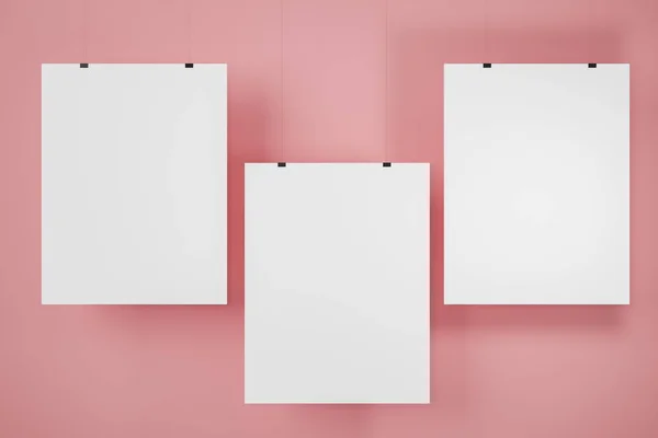 Три вертикальні плакати на рожевій стіні — стокове фото