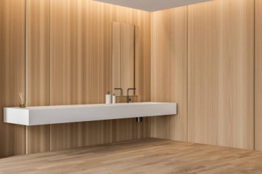 Beyaz lavabolu ahşap banyo köşesi.