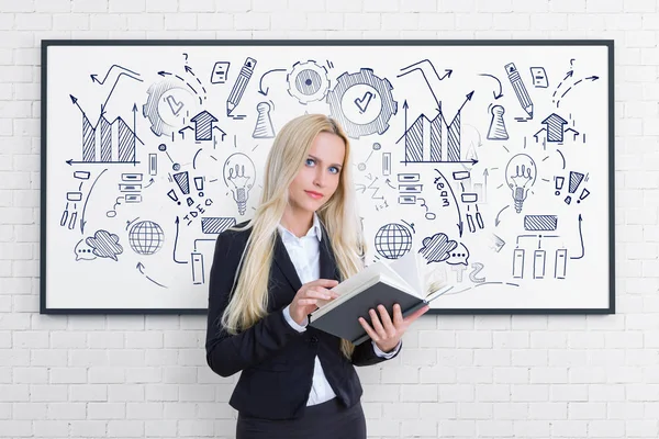 Blonde woman with book, business strategy