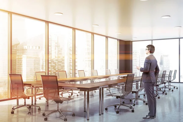 Businessman in panoramic meeting room — Stock Photo, Image