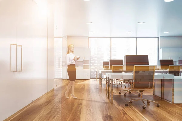 Blonde woman in panoramic office — Stock Photo, Image