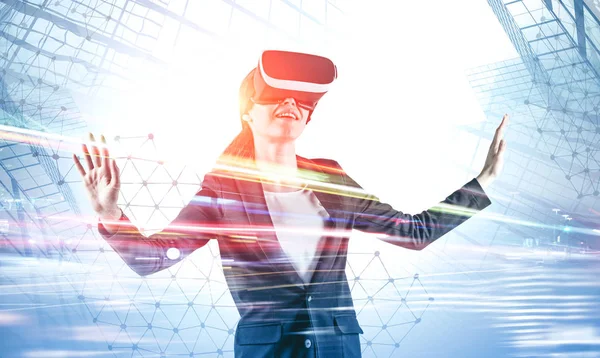 Smiling woman in VR headset in city — Stock Photo, Image