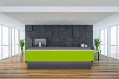 Gri ofiste yeşil resepsiyon masası