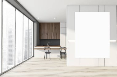 Beyaz ve gri mutfak içi posterlerle dolu.