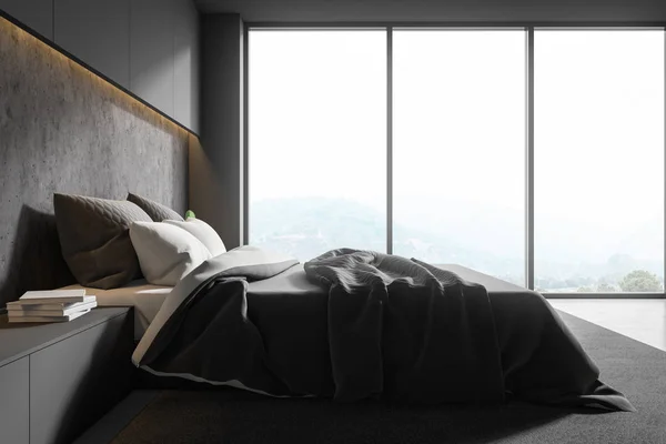 Side view of gray and stone bedroom interior