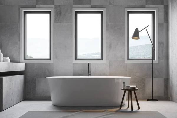 Gray tile bathroom interior with bathtub — Stock Photo, Image