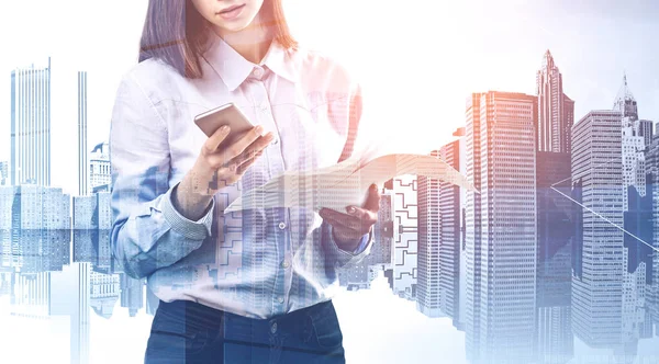 Woman with phone and documents in city — Stock Photo, Image