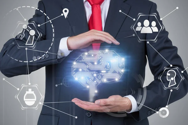 Businessman holding artificial brain hologram — Stock Photo, Image