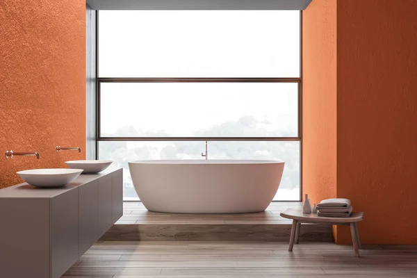 Orange bathroom interior, double sink and tub