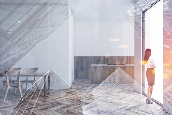 Modern mutfakta yemek masası olan bir kadın.