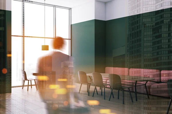 Man in white and green restaurant — Stock Photo, Image