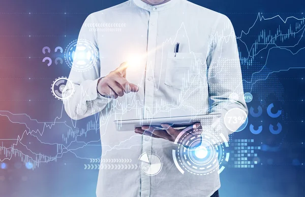 Man with tablet computer, graphs and HUD — Stock Photo, Image