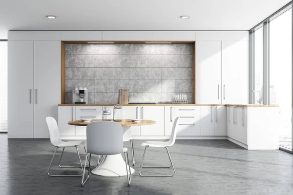 Cozinha branca e de concreto com mesa redonda — Fotografia de Stock