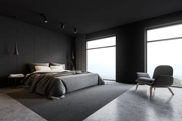 Gray loft master bedroom corner with armchair