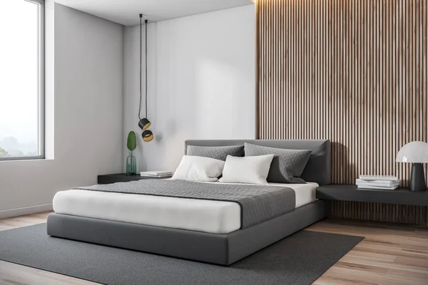 Белый и деревянный мансардный уголок спальни — стоковое фото