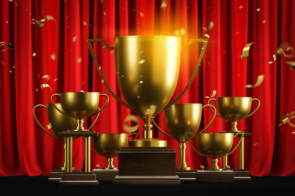 Golden champion trophies and confetti on red — Stock Photo, Image