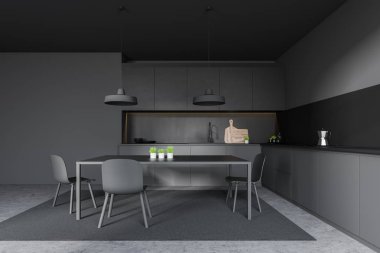 Halı ve masa ile koyu gri mutfak