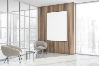 Koltuk ve poster ile bekleme odası köşesi