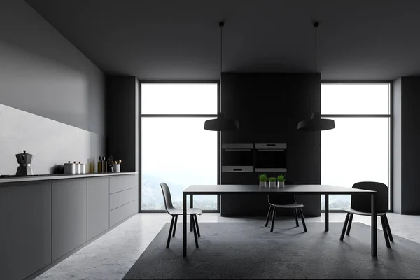 Loft cozinha cinza escuro com mesa — Fotografia de Stock