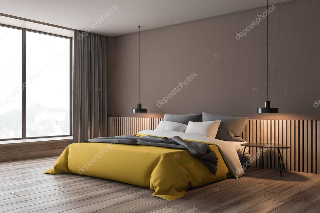 Brown bedroom corner with yellow bed