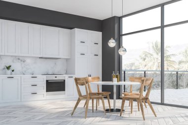 Gri ve beyaz mutfak köşesi, balkon ve masa