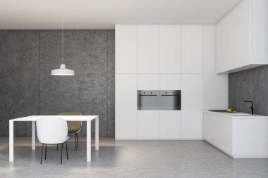 Masa ile beyaz ve beton mutfak